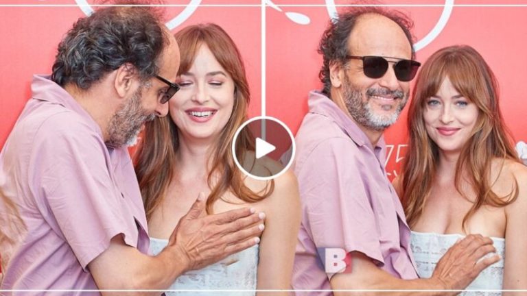 Dakota Johnson in awkward moment with director Luca Guadagnino as he prevents dress slippage